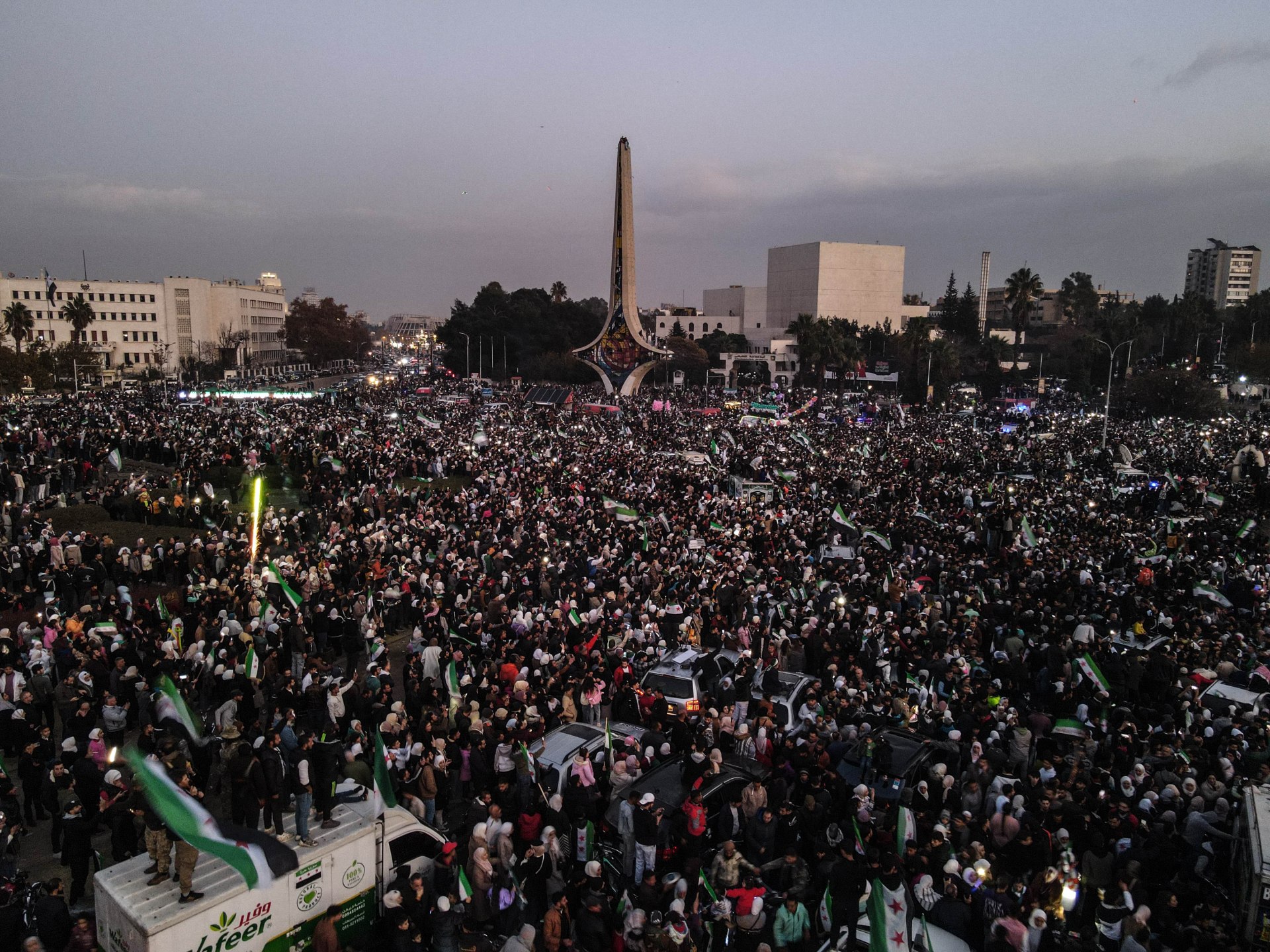 Thousands of Syrians celebrate new government in Umayyad Square | Syria's War