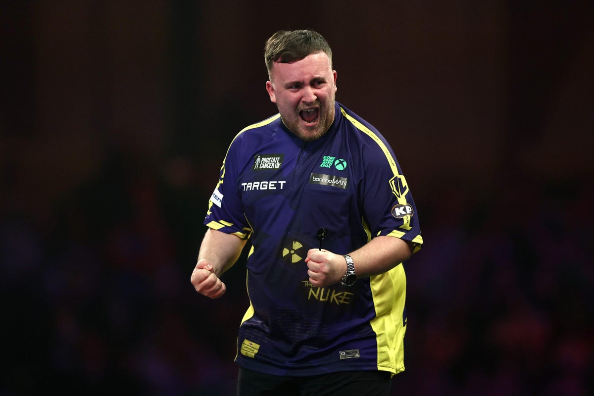 Luke Littler, 17, becomes youngest-ever darts world champion with final win over Michael van Gerwen